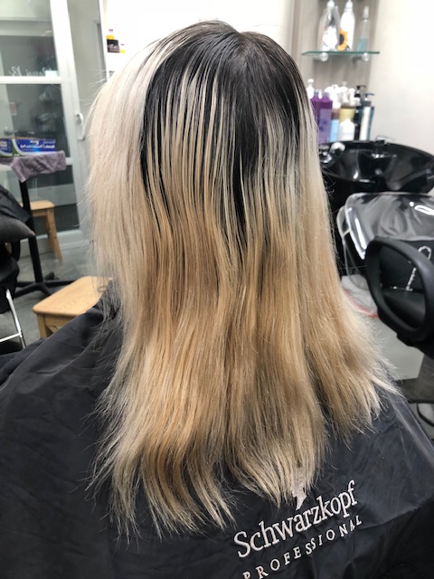 Hair transformation from brassy blonde to beautiful light brown hair color.